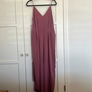 Flowy romper with spaghetti straps and tie in the back. Size xl